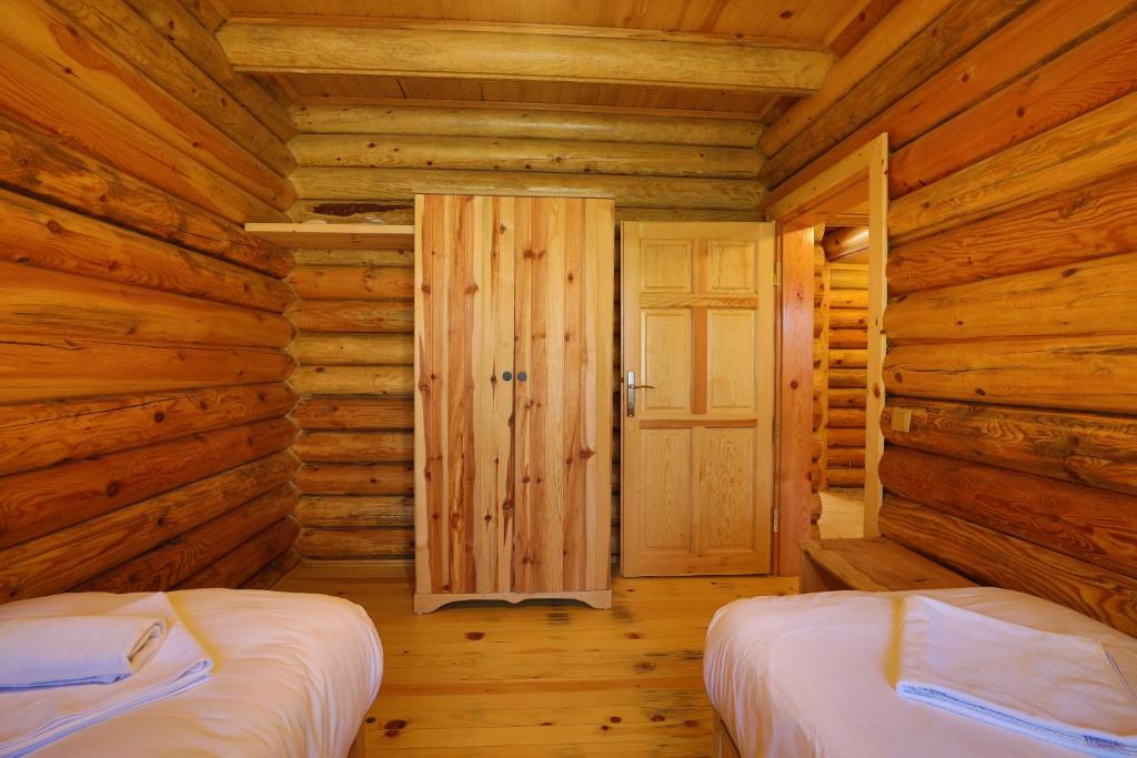 Postel nebo postele na pokoji v ubytování Kayi Apart Hotel