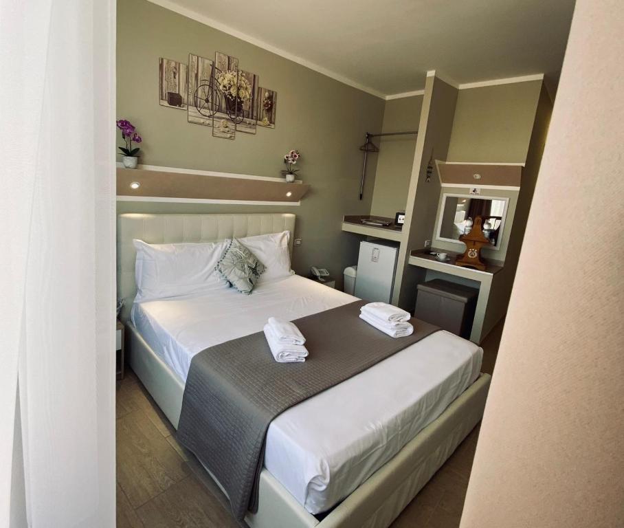 Postel nebo postele na pokoji v ubytování Atico Hotel