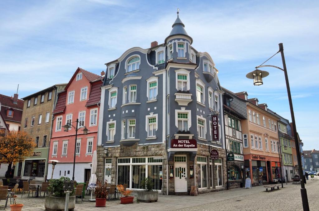a large blue building on a city street at Hotel An der Kapelle in Meiningen