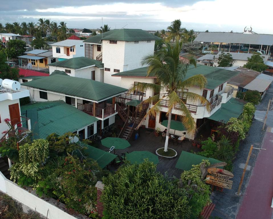 an aerial view of a town with houses at Hotel San Vicente Galapagos in Puerto Villamil