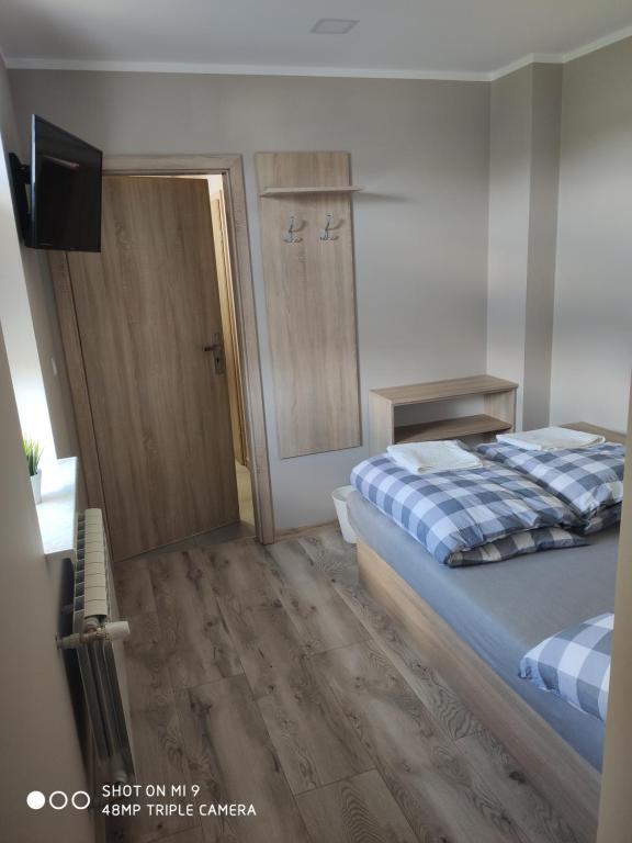 Posteľ alebo postele v izbe v ubytovaní Krollhouse Pokoje gościnne