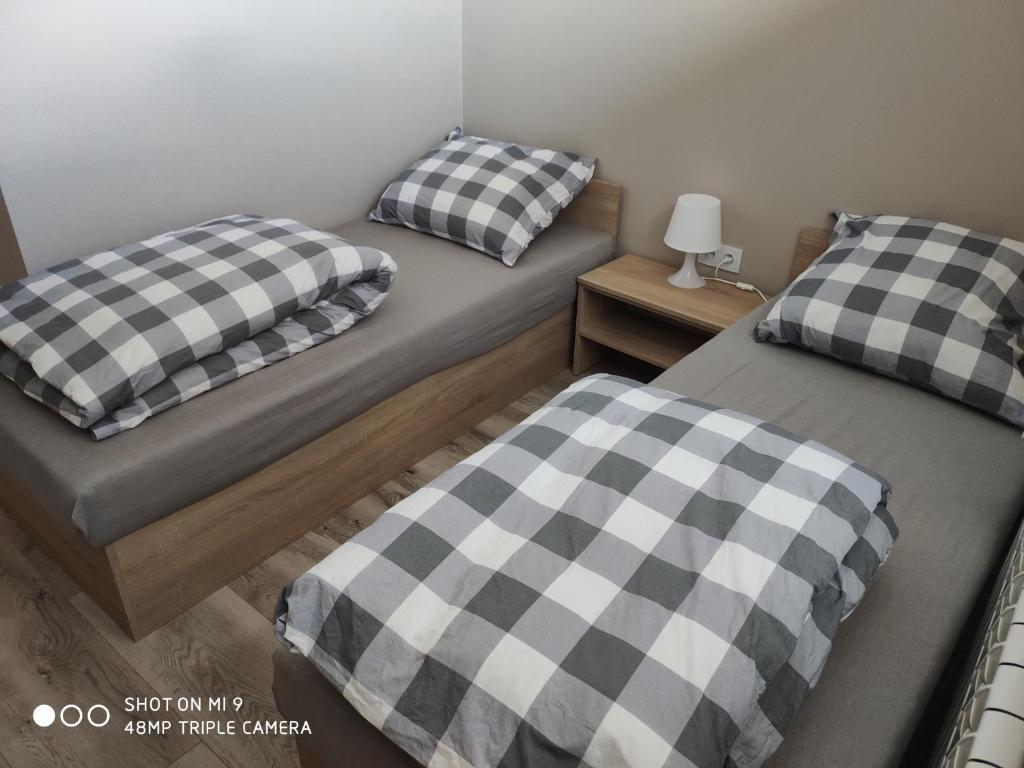Posteľ alebo postele v izbe v ubytovaní Krollhouse Pokoje gościnne