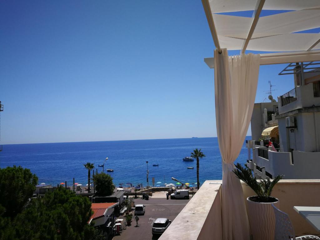 a view of the ocean from a building at B&B Il Mare degli Dei in Letojanni