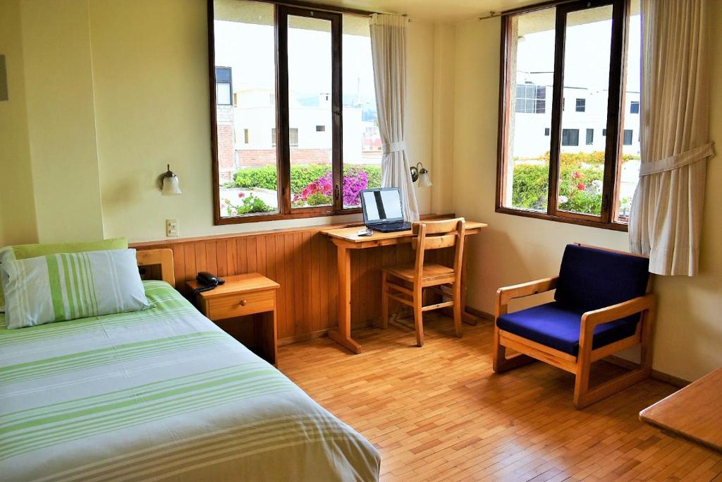 Postel nebo postele na pokoji v ubytování Hotel Rincon Aleman