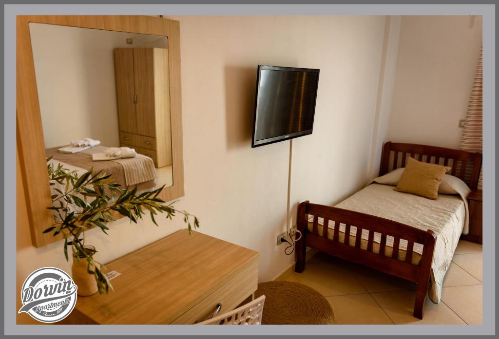 Postel nebo postele na pokoji v ubytování Dorvin Apartments