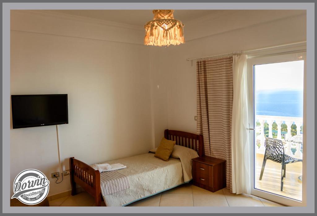 Postel nebo postele na pokoji v ubytování Dorvin Apartments