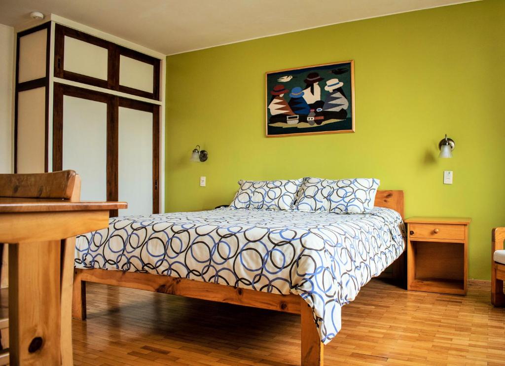 Postel nebo postele na pokoji v ubytování Hotel Rincon Aleman
