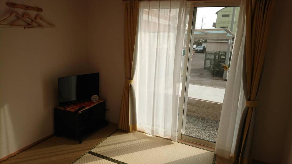 TV a/nebo společenská místnost v ubytování Guesthouse Gifu SUAI