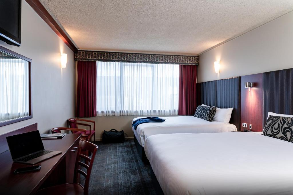 Postel nebo postele na pokoji v ubytování Arkaba Hotel