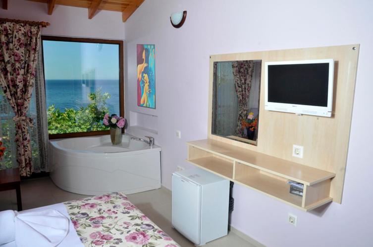 TV a/nebo společenská místnost v ubytování Mola Hotel