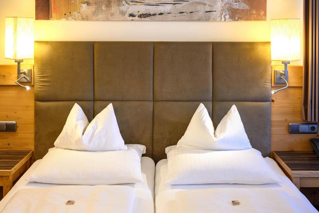 Letto o letti in una camera di Hotel Garni Melanie