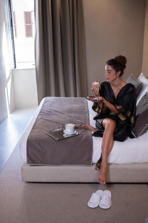 Posteľ alebo postele v izbe v ubytovaní Elysium Suites collection