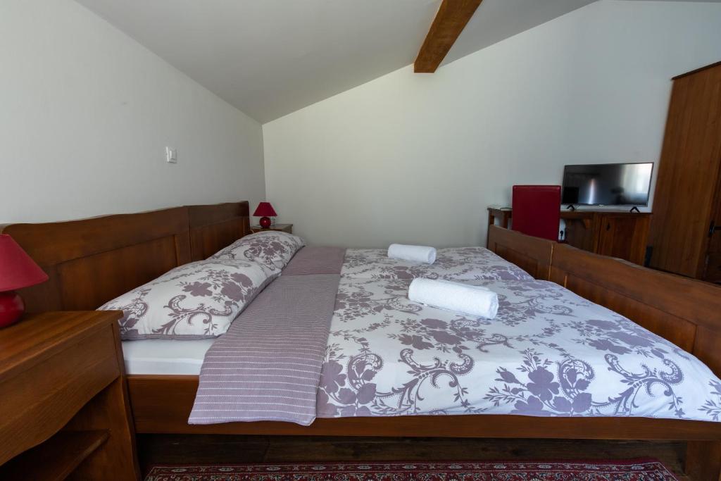 Postel nebo postele na pokoji v ubytování Hotel Lug