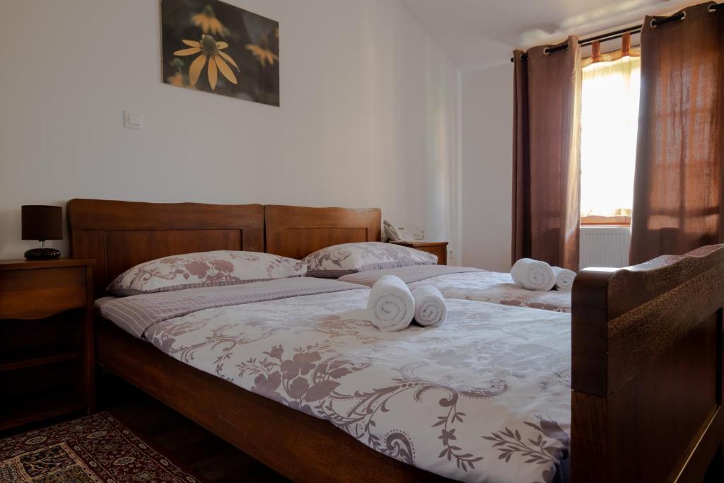 Postel nebo postele na pokoji v ubytování Hotel Lug