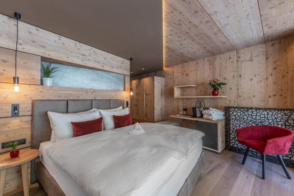 Łóżko lub łóżka w pokoju w obiekcie Almhotel Glieshof