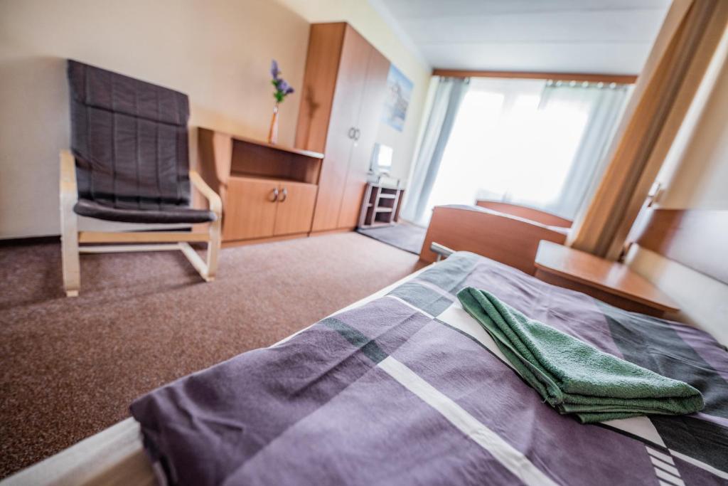 Postel nebo postele na pokoji v ubytování Hotel Penzion Rohožník