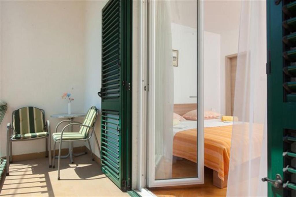 Postel nebo postele na pokoji v ubytování Apartments Marino Gojak