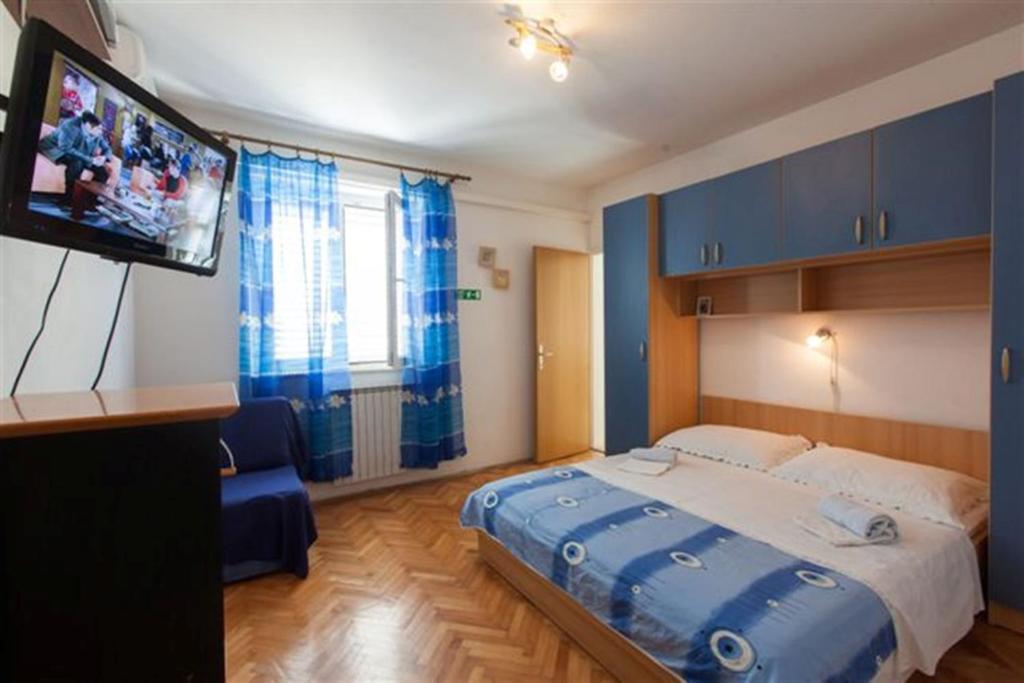 Postel nebo postele na pokoji v ubytování Apartments Marino Gojak