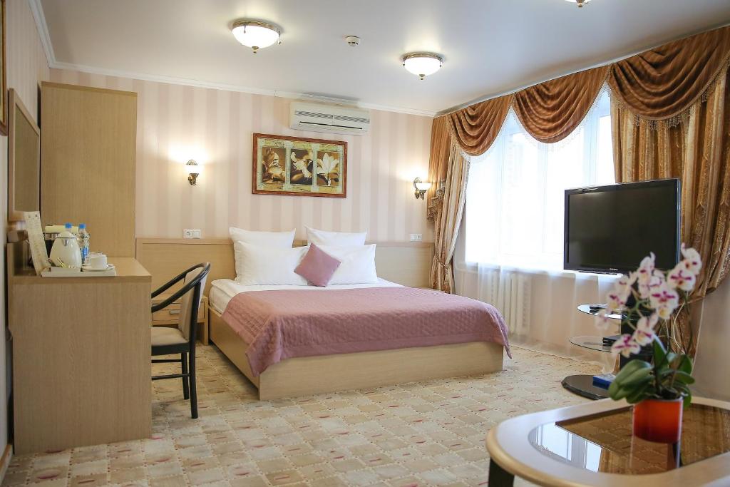 
Кровать или кровати в номере СеверСити гостиница 
