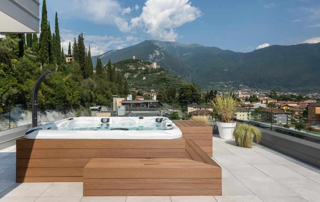 a bath tub sitting on top of a balcony at HOODY ACTIVE & HAPPINESS HOTEL in Arco
