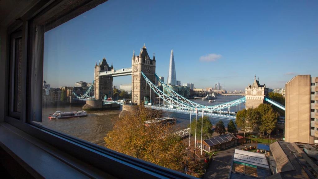 a window with a view of the tower bridge at The Tower Hotel, by Thistle in London