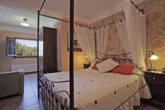 Posteľ alebo postele v izbe v ubytovaní Hotel Rural Xerete