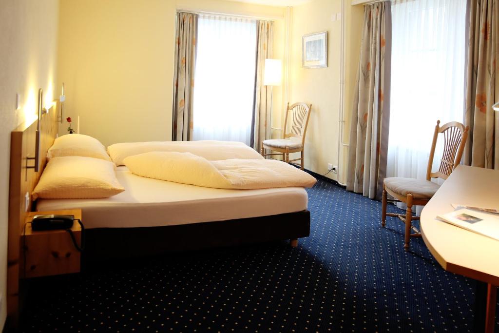 Postel nebo postele na pokoji v ubytování Ambiente Hotel Freieck