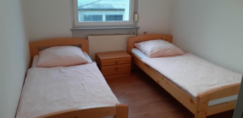 Säng eller sängar i ett rum på Apartment Scholl-Kaspar-Pforzheim