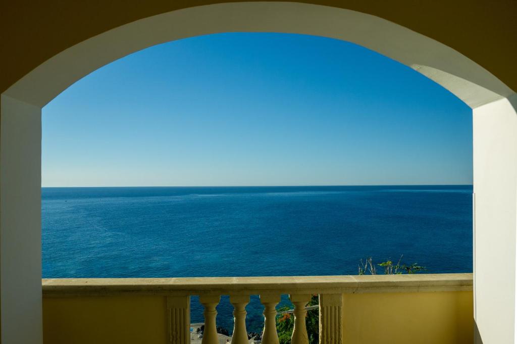 a view of the ocean from a balcony at B&B The Sun 'tis in Castro di Lecce