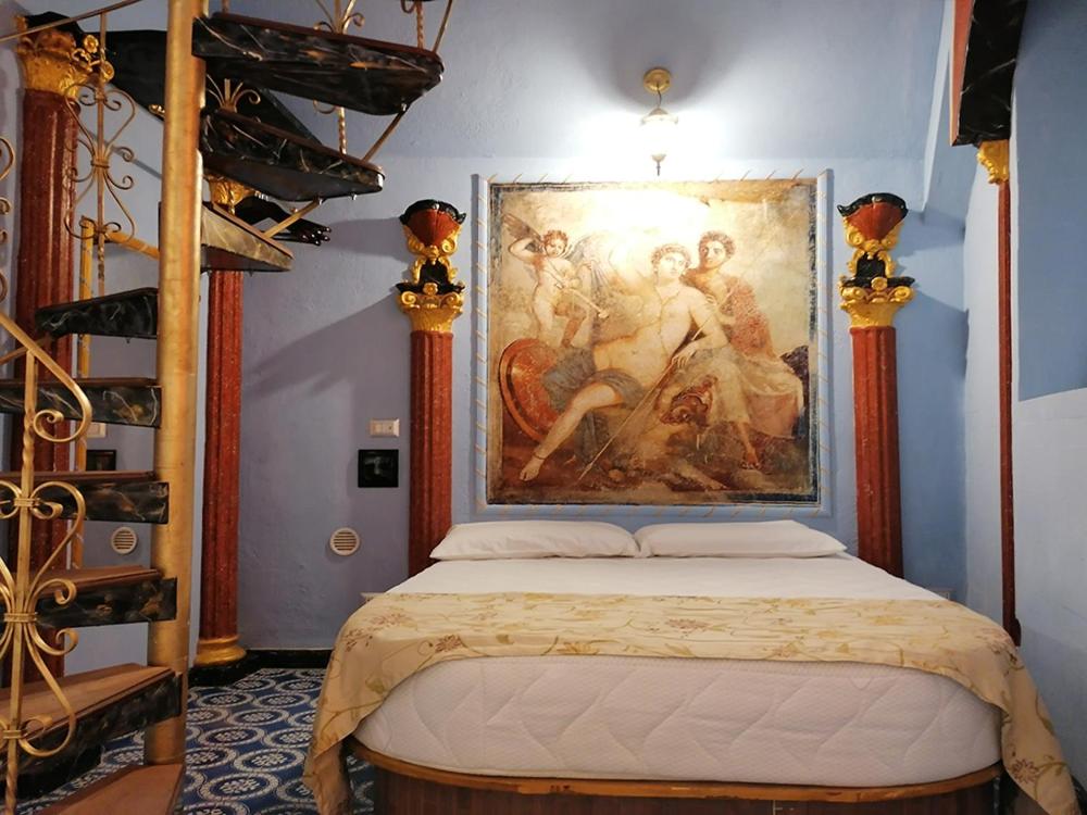Llit o llits en una habitació de Domus Almapetra ai Fori Imperiali