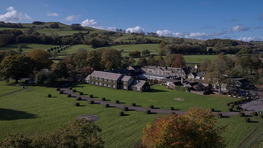 an aerial view of a house on a green field at The Devonshire Arms Hotel & Spa - Skipton in Bolton Abbey