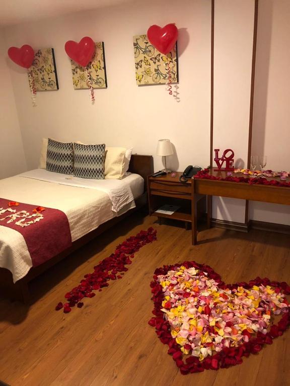 Postel nebo postele na pokoji v ubytování Hotel Maceo Chico