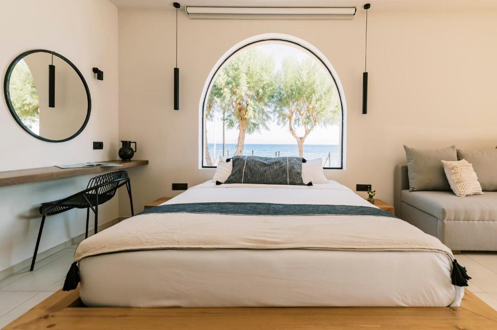 Postel nebo postele na pokoji v ubytování Villa Di Mare Seaside Suites