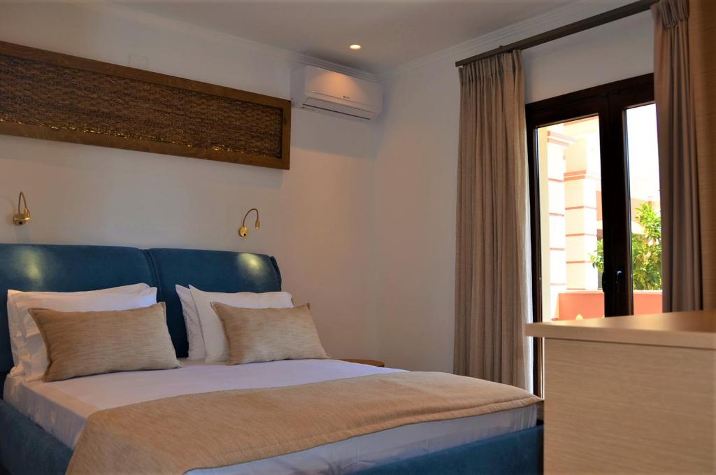 Voodi või voodid majutusasutuse Pagiatakis Suites toas