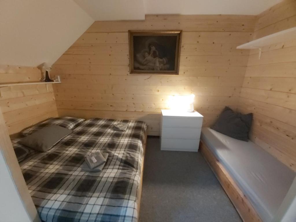 Postel nebo postele na pokoji v ubytování Svatý Jakub
