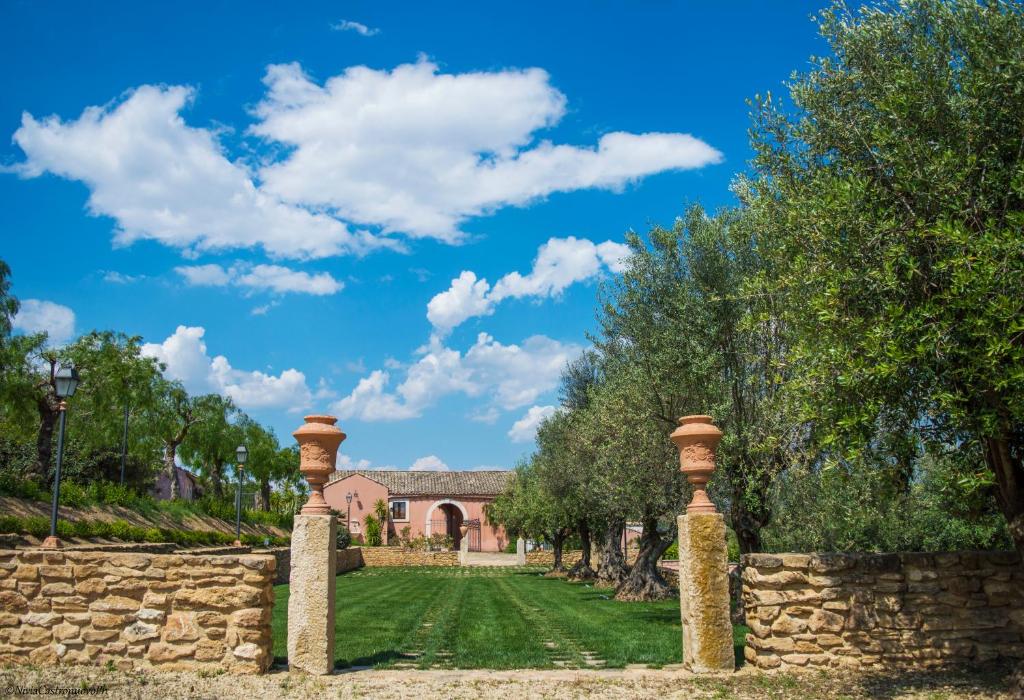 a stone fence in front of a house at Villa D'Andrea in Caltagirone