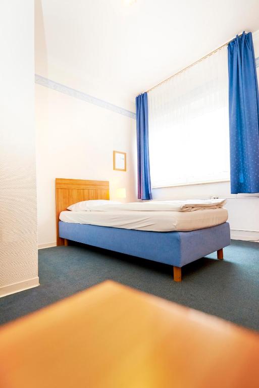 Postel nebo postele na pokoji v ubytování Haus Niemann
