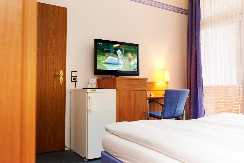 TV a/nebo společenská místnost v ubytování Haus Niemann