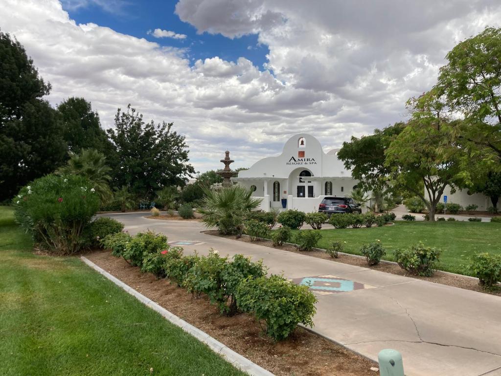 a white chapel with a garden in front of it at Amira Vacation Resort in St. George