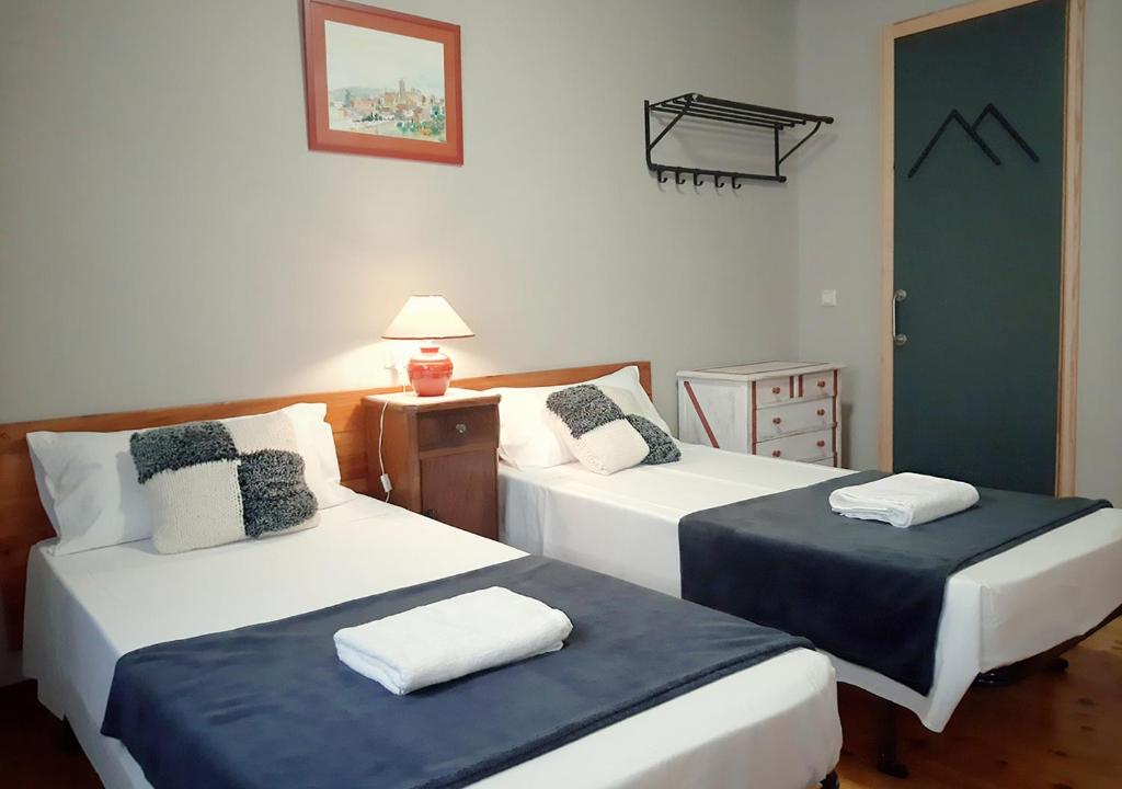 Postel nebo postele na pokoji v ubytování Hostal Fonda Prat