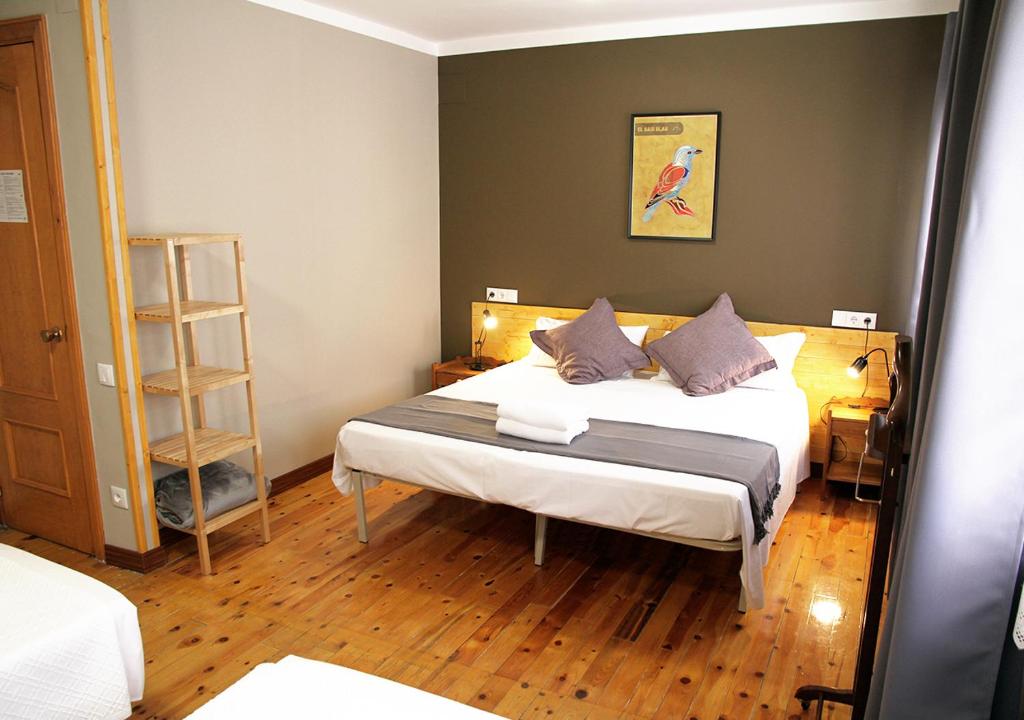Postel nebo postele na pokoji v ubytování Hostal Fonda Prat