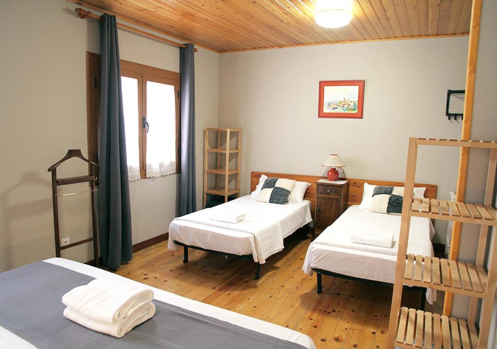 Postel nebo postele na pokoji v ubytování Hostal Fonda Prat