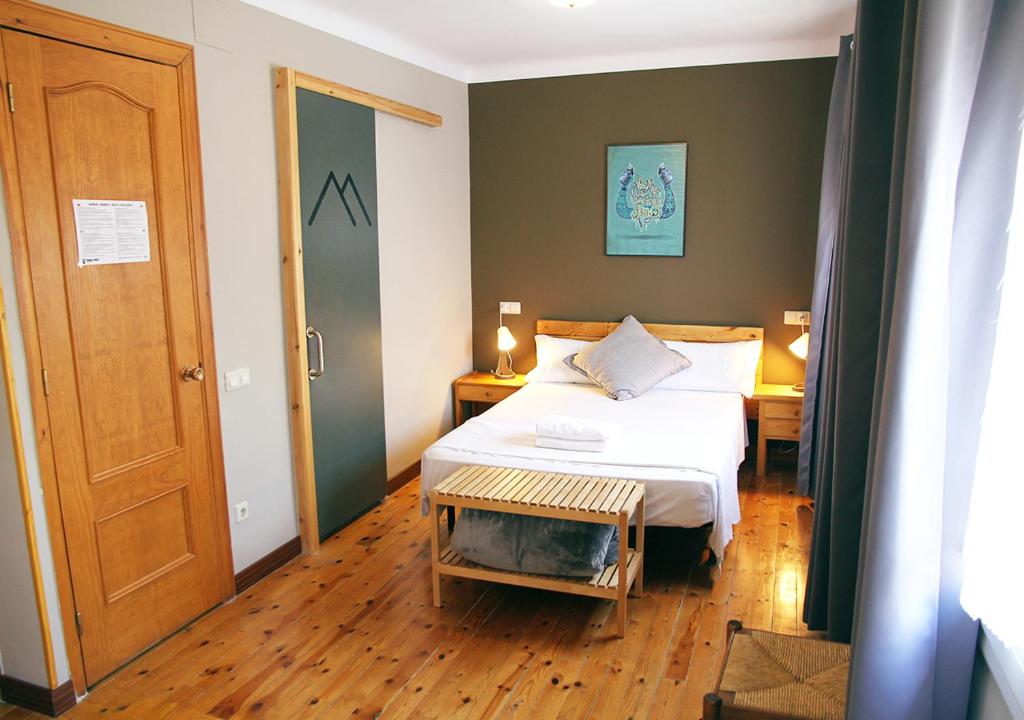 Postel nebo postele na pokoji v ubytování Hostal Fonda Prat
