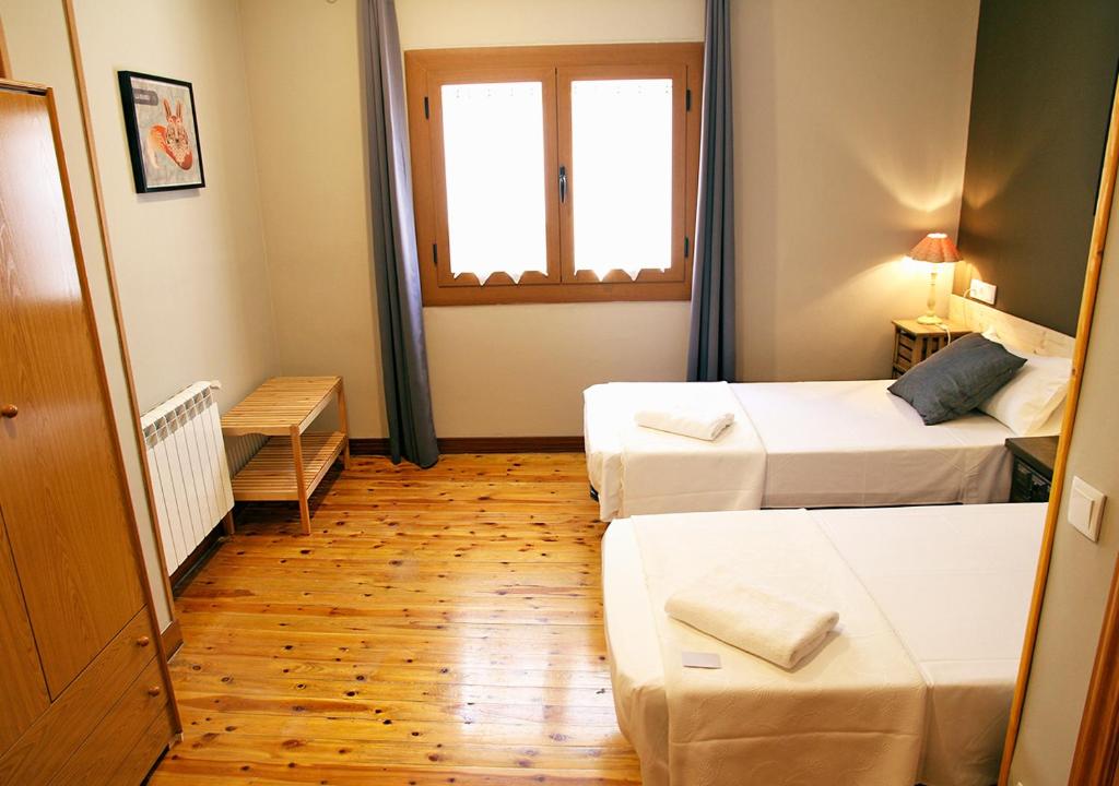 Postel nebo postele na pokoji v ubytování Hostal Fonda Prat