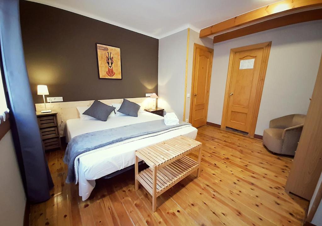 Postel nebo postele na pokoji v ubytování Hostal Fonda Prat