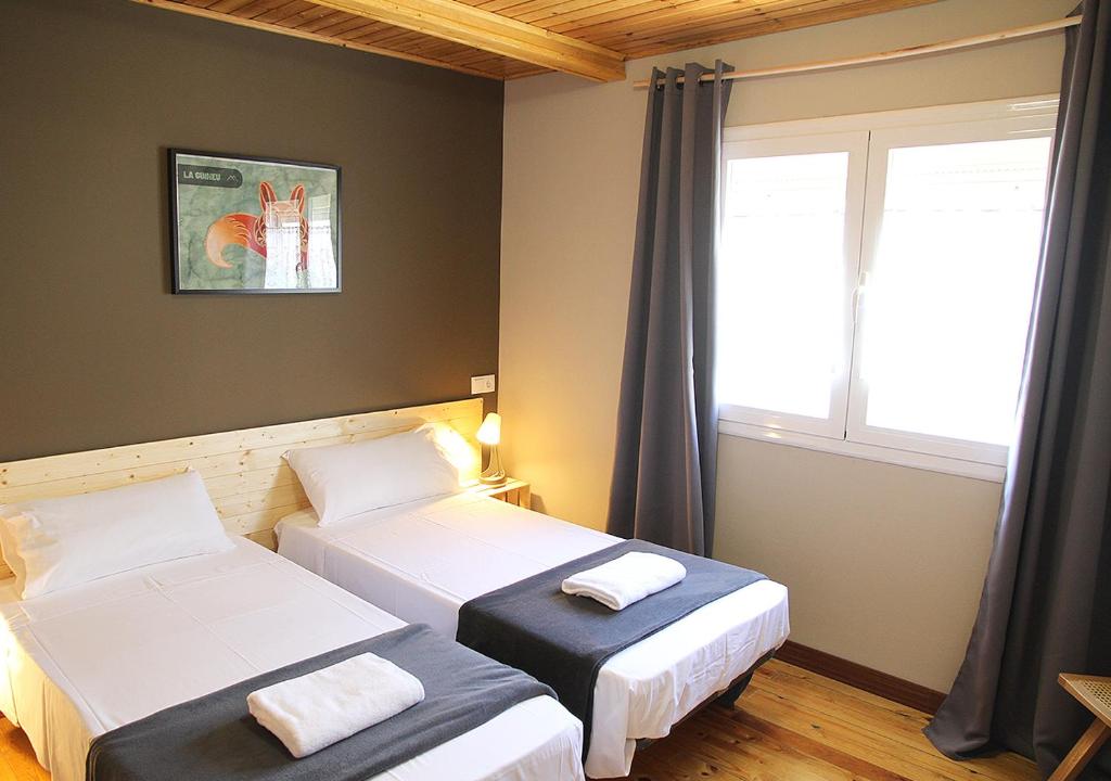Postel nebo postele na pokoji v ubytování Hostal Fonda Prat