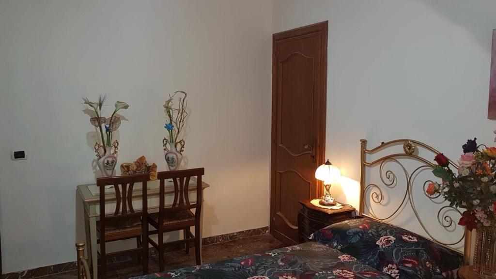 Postel nebo postele na pokoji v ubytování Vecchia Dimora