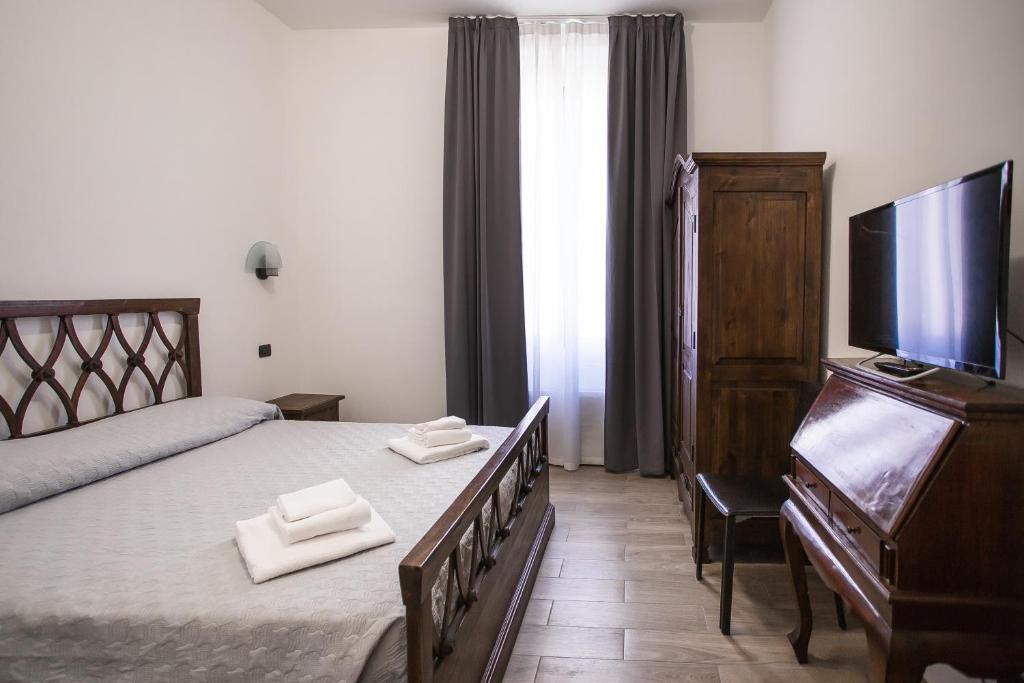 Postel nebo postele na pokoji v ubytování Hotel Amico