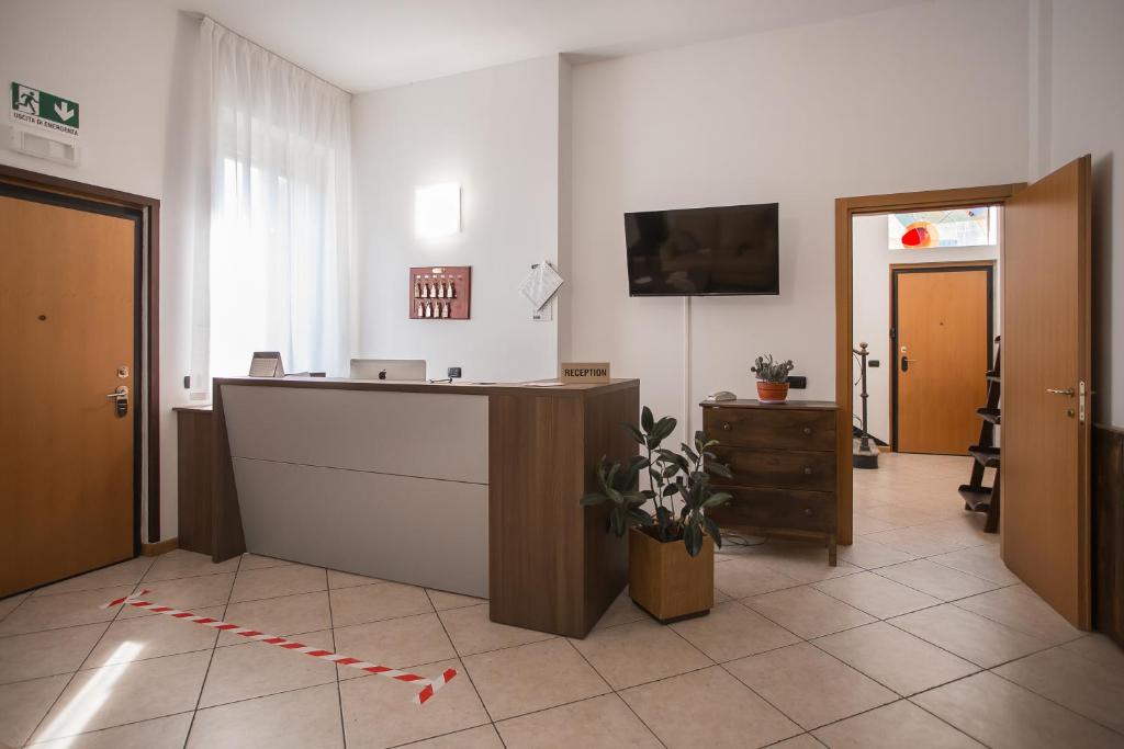 TV a/nebo společenská místnost v ubytování Hotel Amico