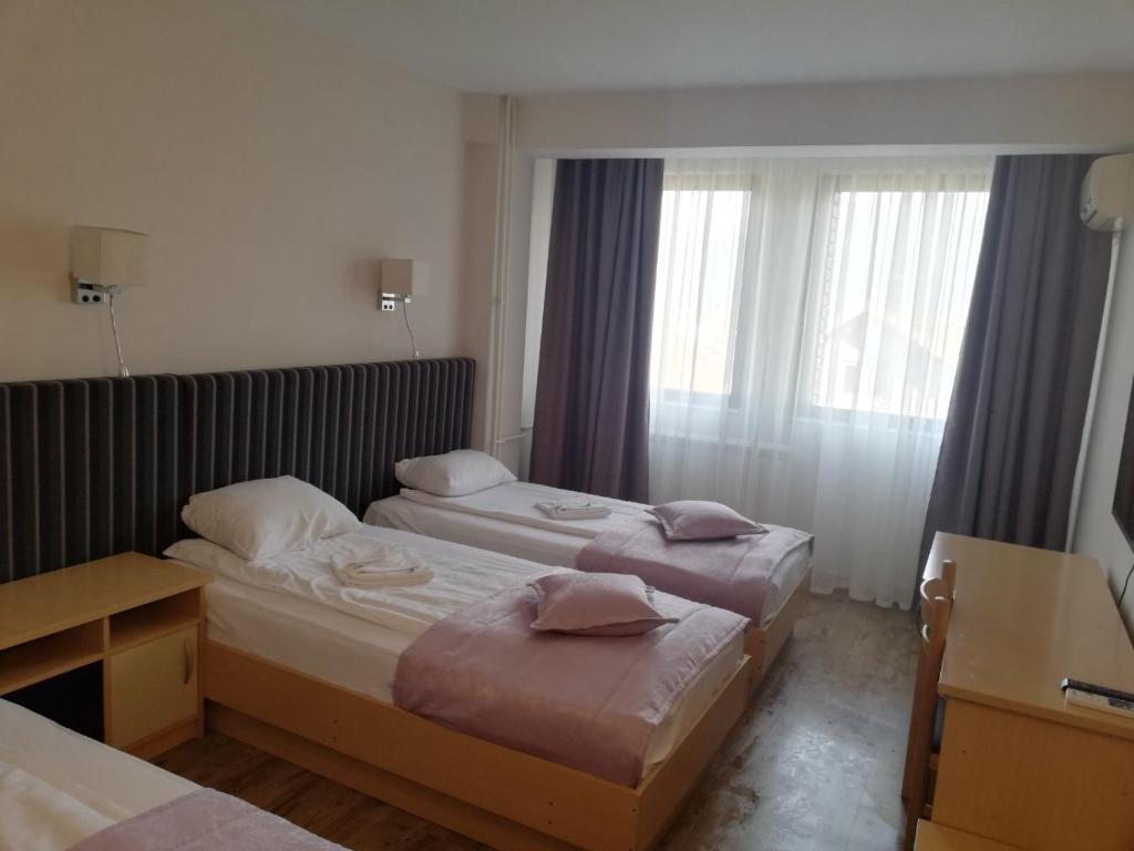 Postel nebo postele na pokoji v ubytování Zepter Hotel Drina Bajina Basta, member of Zepter Hotels